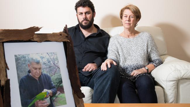 Clive and Barb Spriggs with a photo of father and husband Bob Spriggs, who was mistreated at Oakden. Picture: MATT LOXTON