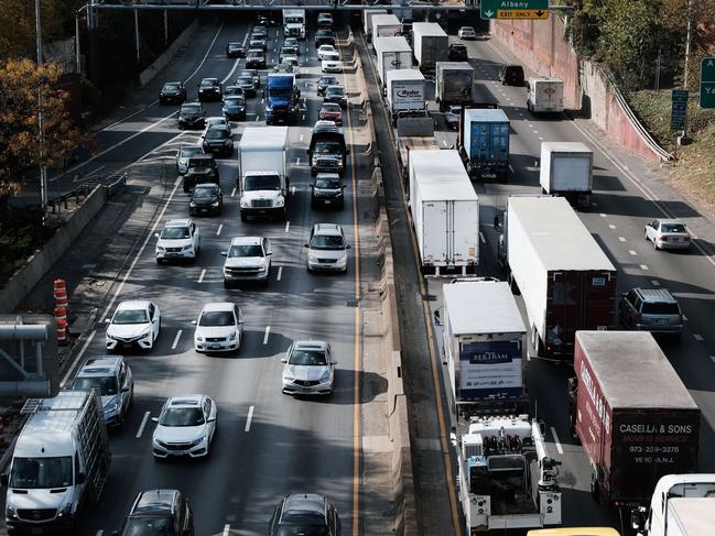 NEW YORK, NEW YORK - NOVEMBER 16: Cars and trucks move along the Cross Bronx Expressway, a notorious stretch of highway in New York City that is often choked with traffic and contributes to pollution and poor air quality on November 16, 2021 in New York City. Funds allocated from the Biden administration's infrastructure legislation will be used to study capping, or putting a deck over, a stretch of the highway as a way to decrease pollution that has caused high rates of asthma in the borough.   Spencer Platt/Getty Images/AFP == FOR NEWSPAPERS, INTERNET, TELCOS & TELEVISION USE ONLY ==