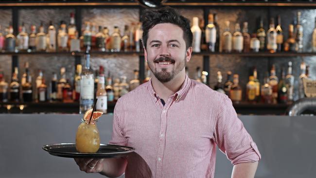 The Lounge by Frogmore Creek bar manager Alex Chaplin with the Mandi’s Paloma cocktail. Picture: LUKE BOWDEN