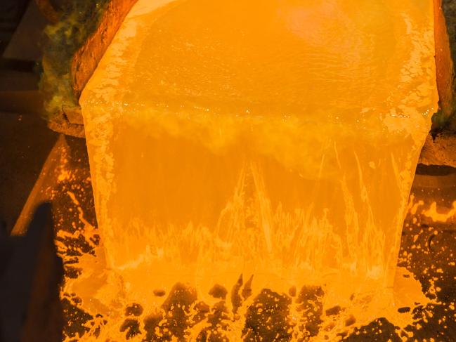 Generic Molten copper pours into an anode casting wheel at the Aurubis AG metals plant in Hamburg, Germany, on Thursday, April 21, 2016. China has accumulated most of the world's copper stocks, with miners and investors trying to figure out what that means for future demand. Photographer: Martin Leissl/Bloomberg