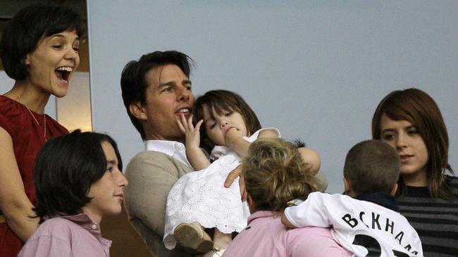 Isabella Cruise with then stepmum Katie Holmes, dad Tom Cruise and their daughter, Suri. Isabella worked for Holmes’ fashion label but left after she split from her dad. Picture: Supplied