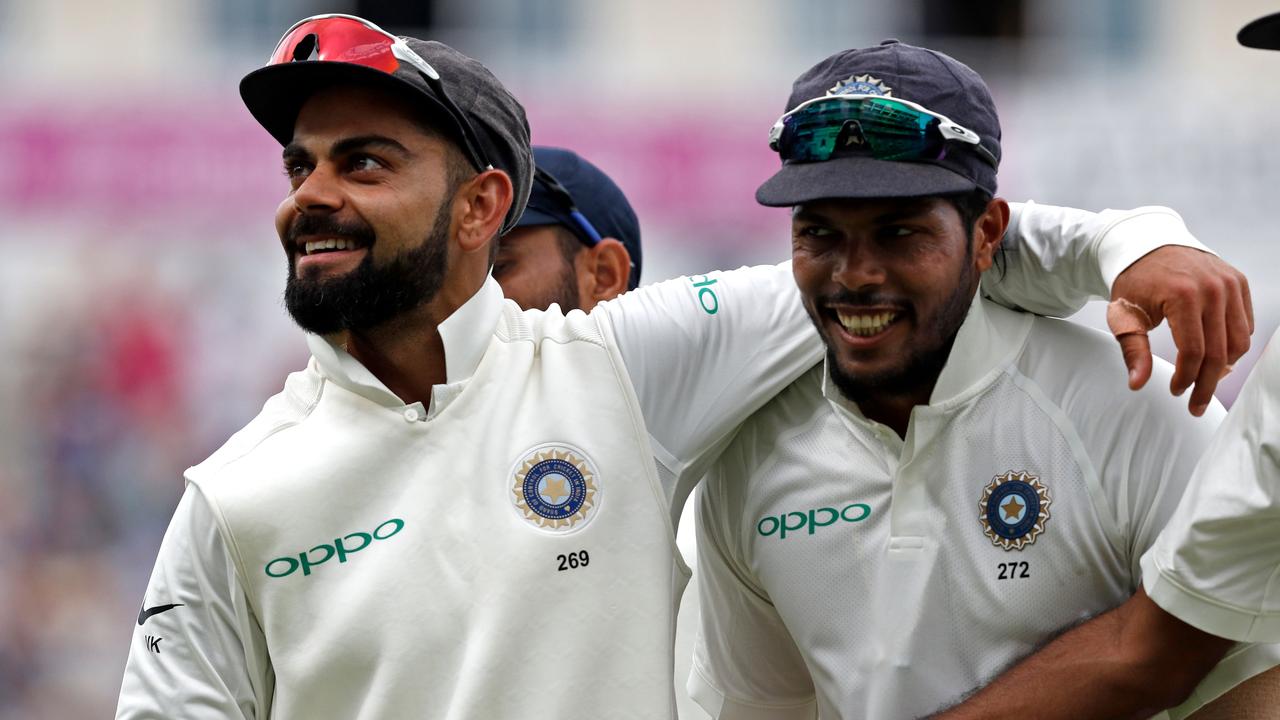 India's captain Virat Kohli (L) walks with bowler Umesh Yadav (R) as they leave the field after bowling England out in their second innings during the third day of the first Test. Photo: Adrian Dennis/AFP