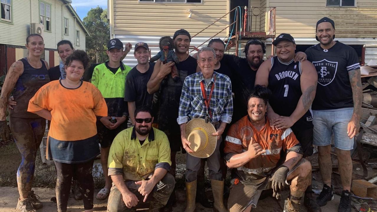 Bill Walsh, 69, surrounded by family friends who helped clean up his Lismore home after he was rescued from raging waters in the NSW flood.