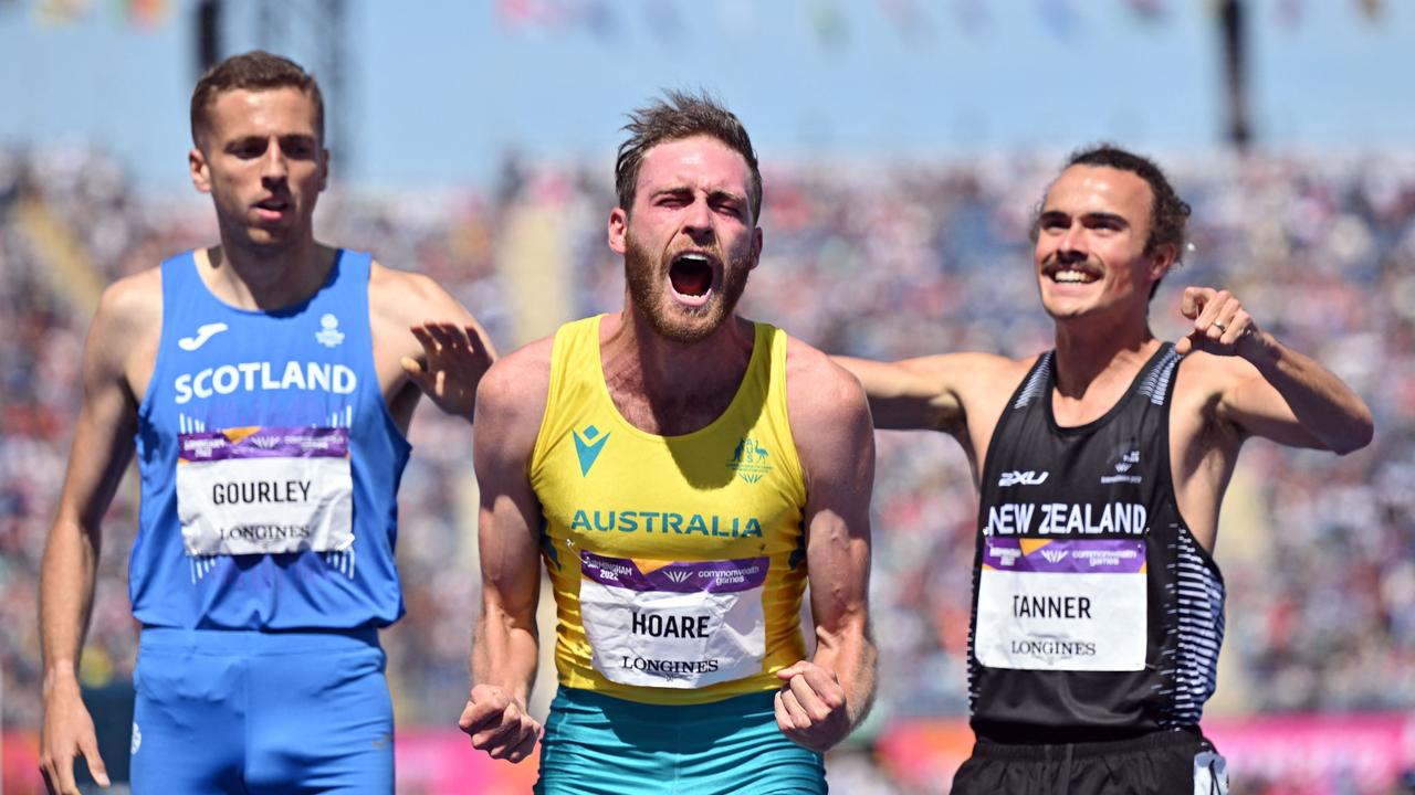 Oliver Hoare (C) celebrates after winning the 1500m final. Picture: Glyn Kirk/AFP