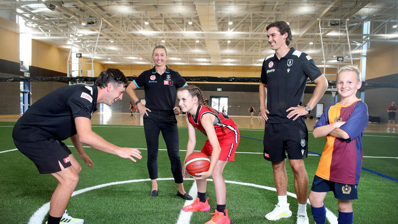 Zak Butters, Cuthbertson and Rozee in the new gym with Amari Cummings, 11, of Fulham Gardens, and Rhys Jones, 9, of Royal Park. Picture: Dean Martin