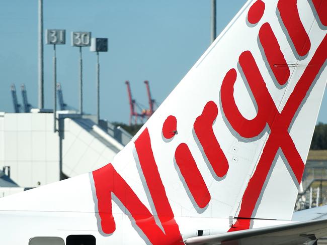 A stock image of a Virgin Australia aircraft at Brisbane Airport, Brisbane, Wednesday, August 29, 2018.  Virgin Australia has today posted a full-year loss of $681 million. (AAP Image/Dan Peled) NO ARCHIVING