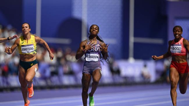 Bree Masters runs into the semi final of the 100m behind USA star Sha'Carri Richardson. Picture: Jewel Samad / AFP