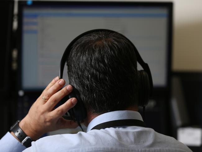 What’s that again? An AFP detective monitoring telephone surveillance. Picture: Brendan Francis