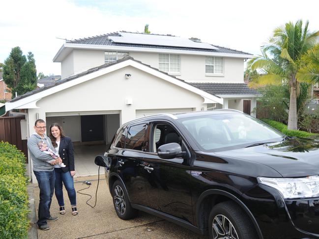 Dragos Tita, wife Jamie and daughter Audrey have 12 solar panels on their roof of the Bossley Park home.