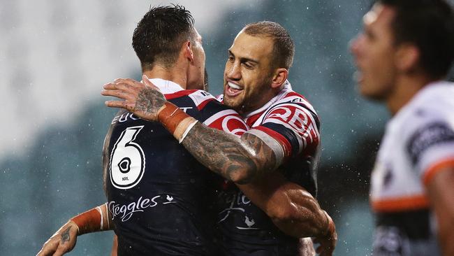 Roosters Blake Ferguson celebrates after scoring a try.