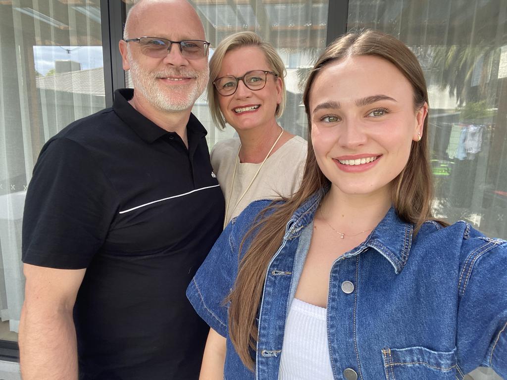 Bryony Baker with her parents, Sue and Paul, says one teacher helped her turn study around after an ADHD diagnosis. Picture: supplied