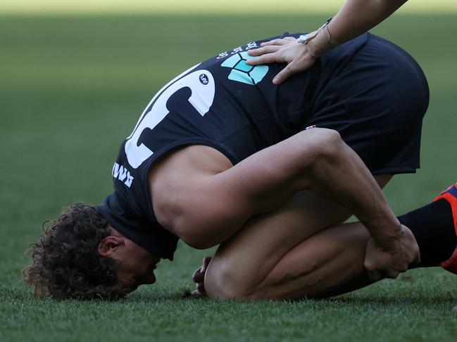 Charlie Curnow of the Blues reacts after sustaining an injury during the round 22 AFL match. (Photo by Daniel Pockett/Getty Images)