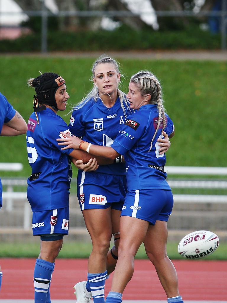 Diehards' Kody House (centre) is congratulated by her team mates after scoring a try in the QRL BHP Premiership match between the North Queensland Gold Stars and the Valleys Diehards, held at Barlow Park. Picture: Brendan Radke