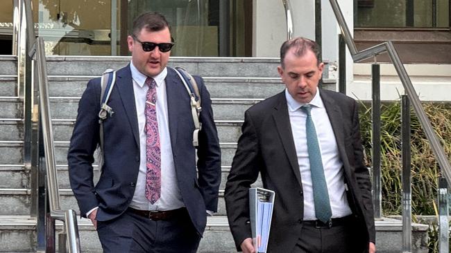 Keith Eshman (left) leaving Wollongong District Court on Monday with his lawyer Robert Candelori. Picture: Dylan Arvela