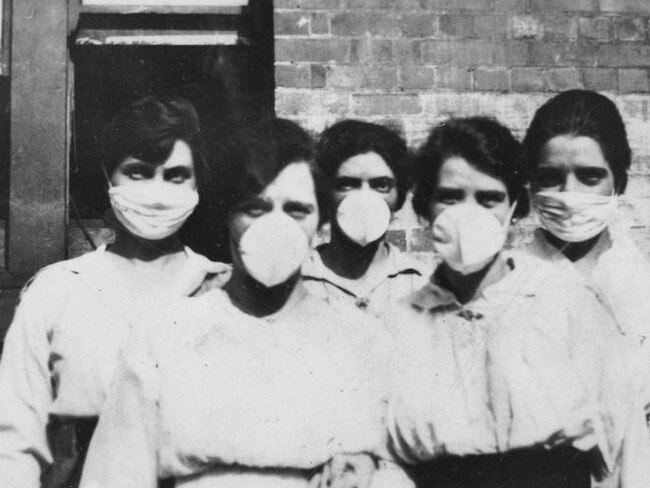 Women wearing surgical masks during the epidemic in 1919.