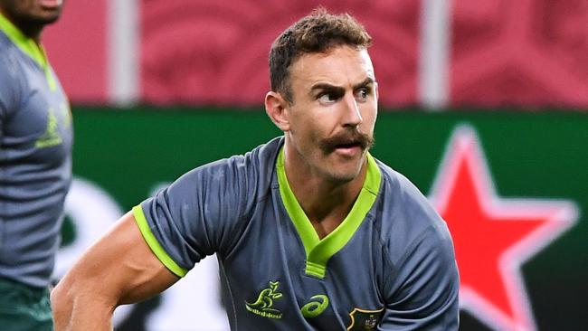 Australia's half-back Nic White (R) passes the ball during the Captain's Run in Sapporo on September 20, 2019, ahead of the Japan 2019 Rugby World Cup. (Photo by William WEST / AFP)