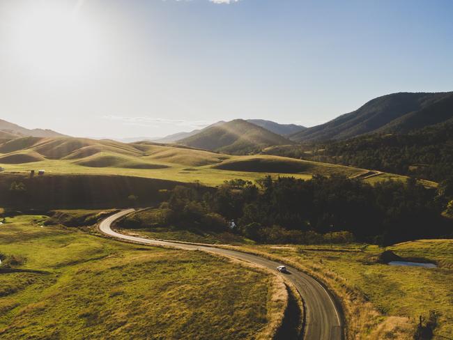 Car taking the scenic drive along Thunderbolts Way on the Barrington Coast.Barrington Coast NSWPhoto: Guy WillimentsuppliedEscape13 February 2022Top Gear - Esky Chiller, roadtrip produce