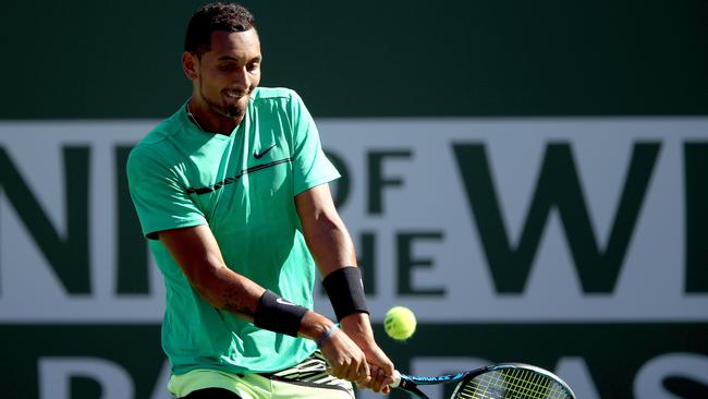 INDIAN WELLS, CA — MARCH 15: Nick Kyrgios of Australia returns a shot to Novak Djokovic of Serbia during the BNP Paribas Open at the Indian Wells Tennis Garden on March 15, 2017 in Indian Wells, California. Matthew Stockman/Getty Images/AFP == FOR NEWSPAPERS, INTERNET, TELCOS &amp; TELEVISION USE ONLY ==