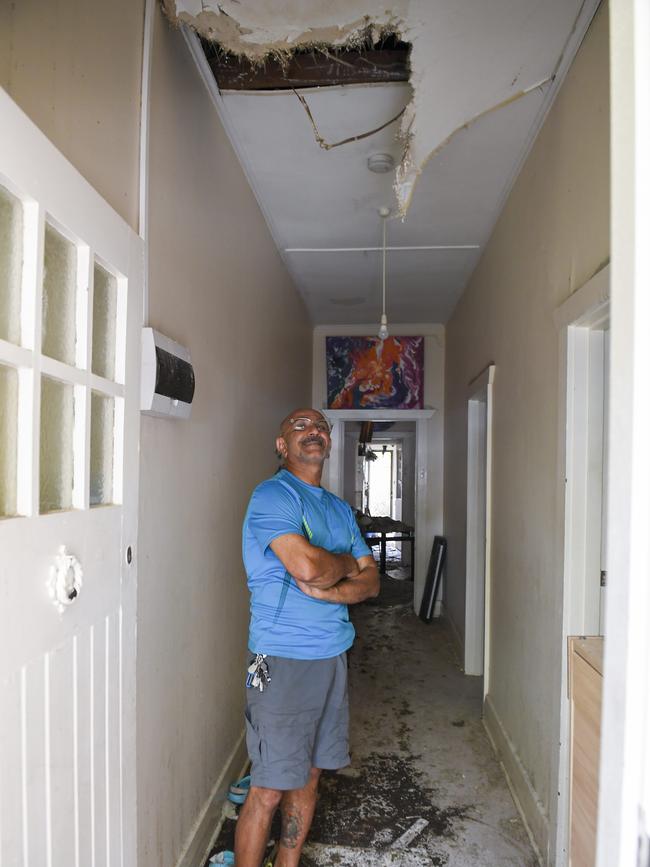 Hamid Tahmasebi looks at the damage in his house. Picture: Mark Brake