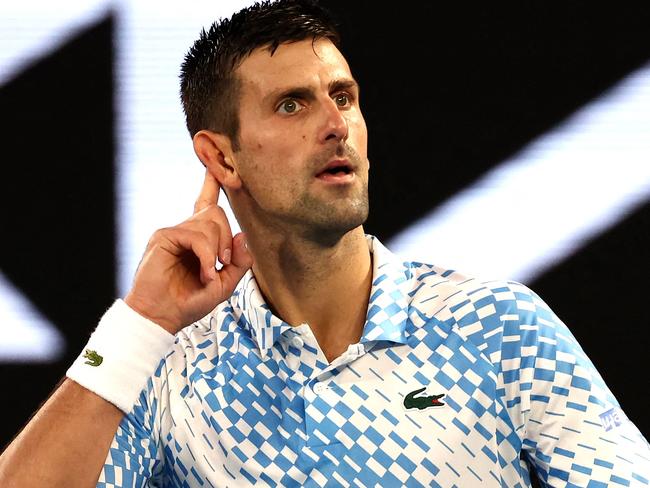 Serbia's Novak Djokovic reacts on a point against Tommy Paul of the US during their men's singles semi-final match on day twelve of the Australian Open tennis tournament in Melbourne on January 27, 2023. (Photo by DAVID GRAY / AFP) / -- IMAGE RESTRICTED TO EDITORIAL USE - STRICTLY NO COMMERCIAL USE --