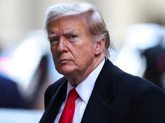 Former US President Donald Trump arrives at 40 Wall Street following his court hearing to determine the date of his trial for allegedly covering up hush money payments linked to extramarital affairs in New York City on March 25, 2024. Judge Juan Merchan rejected demands from Trump's lawyers to delay the first ever criminal trial of a former president for at least 90 days and ordered jury selection to begin on April 15. (Photo by Charly TRIBALLEAU / AFP)