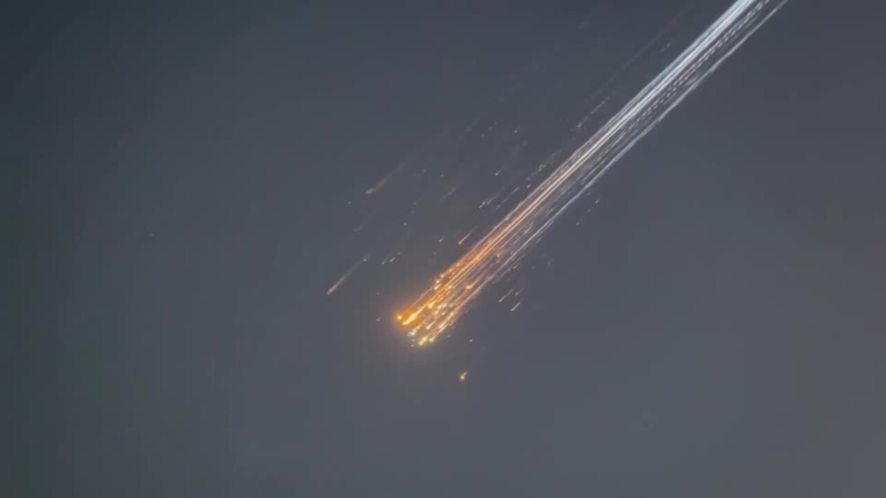 Falling debris from SpaceX's Starship streaks through the sky