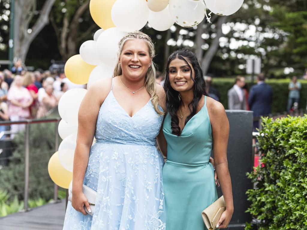 Chloe Ives (left) and Sara Chandran at Centenary Heights State High School formal at Picnic Point, Friday, November 15, 2024. Picture: Kevin Farmer