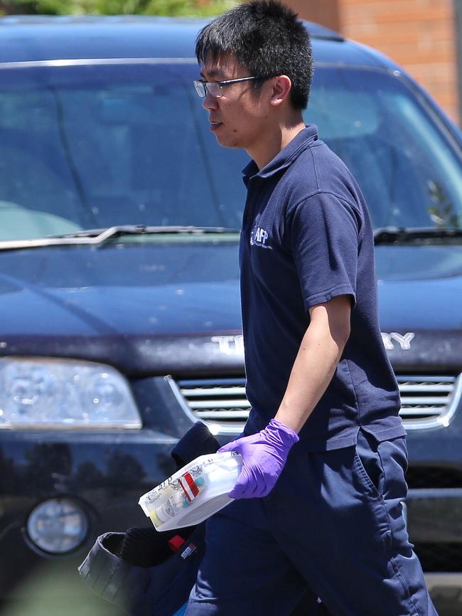 Police remove items the house. Picture: Herald Sun