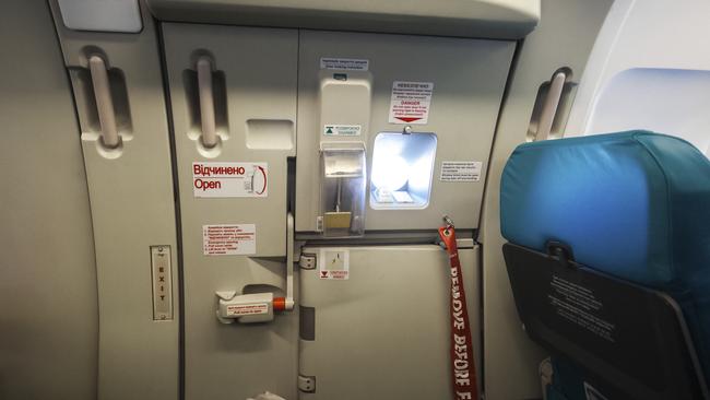 Photograph of a generic emergency exit door.