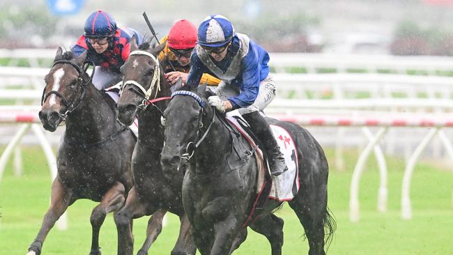 Superalloy ploughs through the mud to win the Listed Gold Edition and give jockey Angela Jones her third winner for the day. Picture: Grant Peters/Trackside Photography