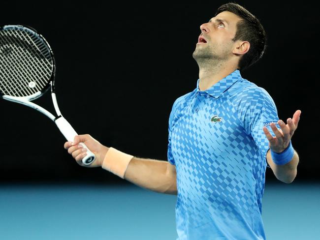 MELBOURNE, AUSTRALIA - JANUARY 17: Novak Djokovic of Serbia reacts in their round one singles match against Roberto Carballes Baena of Spain during day two of the 2023 Australian Open at Melbourne Park on January 17, 2023 in Melbourne, Australia. (Photo by Kelly Defina/Getty Images)