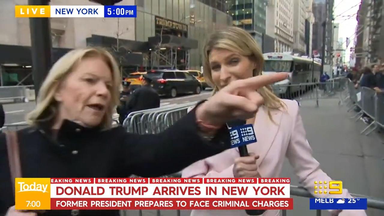 An angry Trump fan interrupted Piotrowski’s live cross. Picture: Channel 9.