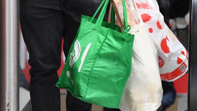 Coles will keep giving away free plastic bags for the foreseeable future after consumer outrage over having to remember reusable bags. (Pic: Peter Rae/AAP)