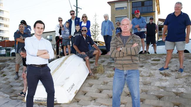 MP Sam O'Conner, left, and local resident Wayne Hayes, with other Labrador locals in support of the “iconic” foreshore tinnies. Picture: Tertius Pickard