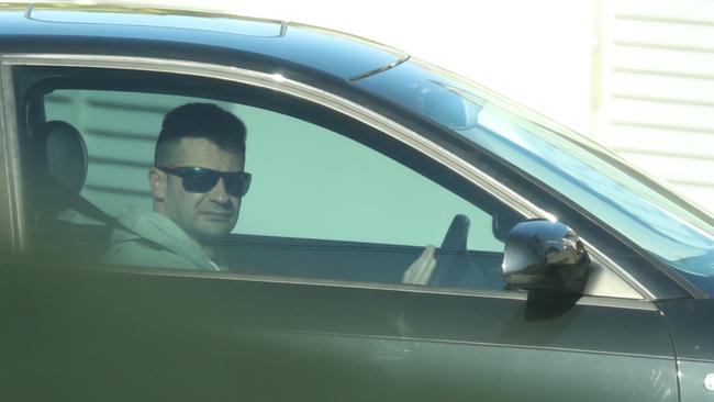 Anthony Koletti, the partner of missing Melissa Caddick, behind the wheel of his new car on Thursday. Picture: John Grainger