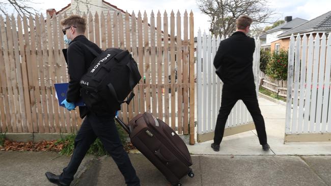 Detectives at the home in Blackburn North where the children were abducted. Picture: David Crosling