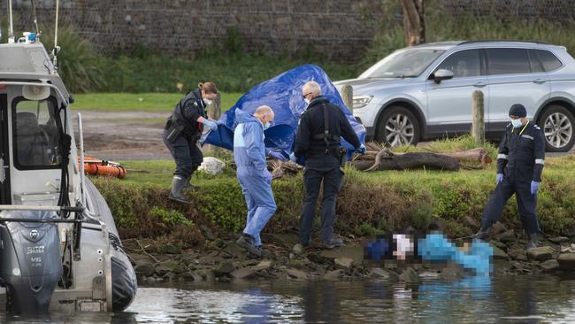 Police at the scene where 85-year-old Lolene Whitehand’s body was found in the Maribyrnong River. Picture: Tony Gough