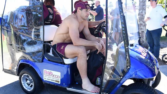 Billy Slater is driven away for treatment after rolling his ankle in Queensland camp.