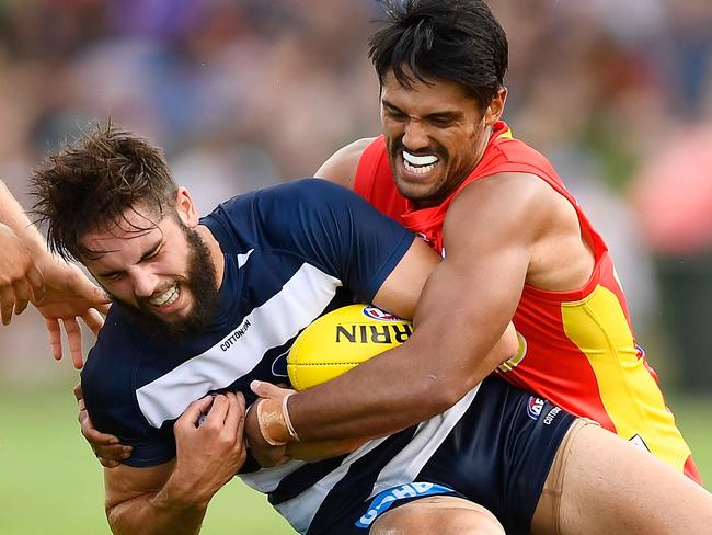 TOWNSVILLE, AUSTRALIA - MARCH 04:  Aaron Hall of the Suns tackles James Parsons of the Cats during the AFL JLT Community Series match between the Geelong Cats and the Gold Coast Suns at  Riverway Stadium on March 4, 2018 in Townsville, Australia.  (Photo by Ian Hitchcock/Getty Images)