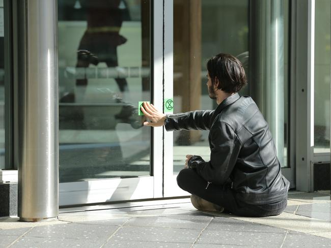 Eric Herbert protesting outside a Brisbane courthouse.