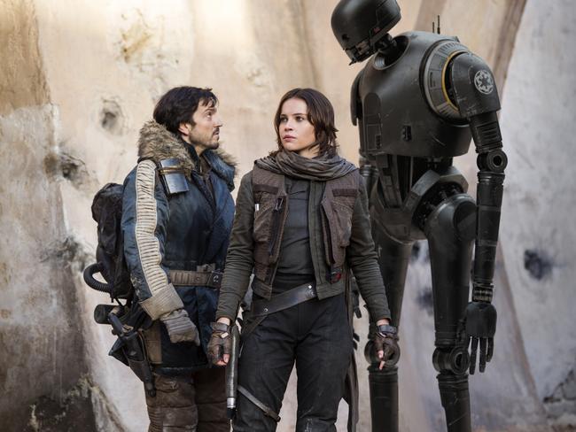 Scene from film Rogue One: A Star Wars Story L to R: Cassian Andor (played by Diego Luna), Jyn Erso (Felicity Jones) and K-2SO (Alan Tudyk). Picture: Lucasfilm Ltd.