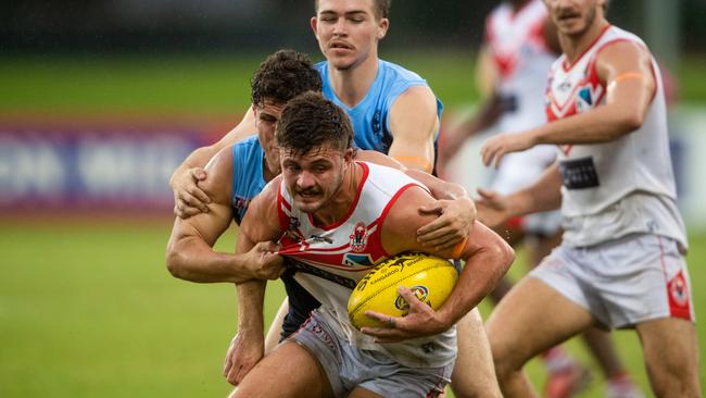 Round 17 NTFL: Darwin Buffaloes v Waratah at TIO Stadium. Tah's Sam Godden is tackled. Photograph: Che Chorley