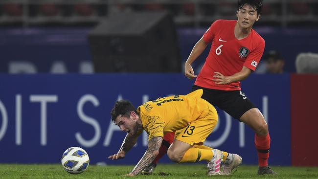 Aiden O'Neill finds life tough against the impressive South Koreans.