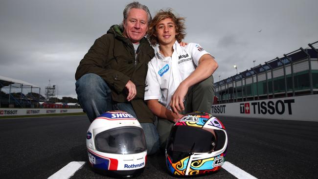 PHILLIP ISLAND, AUSTRALIA - OCTOBER 16: Former 500cc World Champion Wayne Gardner poses with his son Remy ahead of the 2014 MotoGP of Australia at Phillip Island Grand Prix Circuit on October 16, 2014 in Phillip Island, Australia. Remmy Gardner will race this weekend in the Moto3 for Team Laglisse Calvo. (Photo by Robert Cianflone/Getty Images)