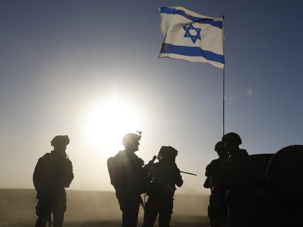 Israeli soldiers patrol near the border with Gaza in southern Israel. Picture: Getty Images