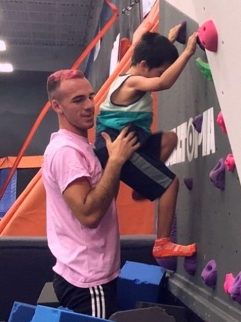 Brian Laundrie with his nephew and pink hair in a throwback photo.