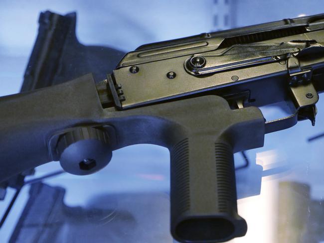 A little-known device called a "bump stock" is attached to a semiautomatic rifle at the Gun Vault store and shooting range Wednesday, Oct. 4, 2017. Picture: AP.