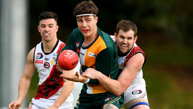 NFNL: Northcote Park’s Rory Patterson is caught by Tim Bongetti of Eltham. Picture: Josh Chadwick