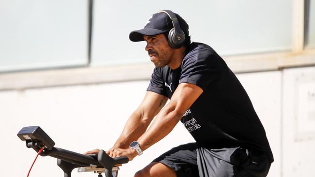 Eddie Betts watches training from the sidelines while on the exercise bike. Picture: Dylan Burns/AFL Photos via Getty Images