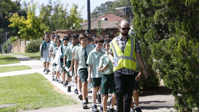  Students are pictured returning to school during a lockdown procedure.